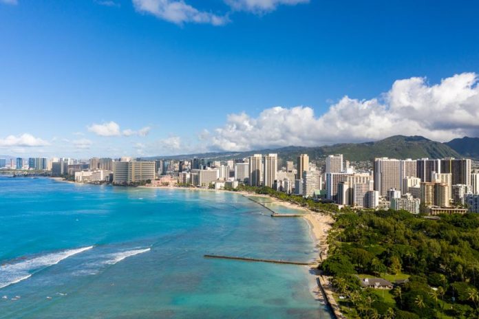 Aerial drone view of the sea front on Waikiki with Honolulu in the background